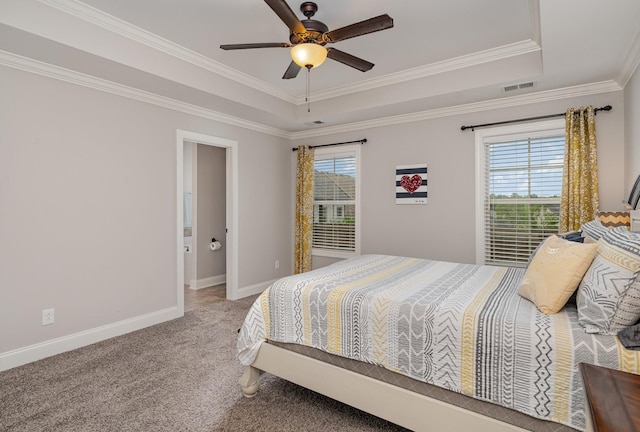 bedroom with carpet flooring, a raised ceiling, ceiling fan, crown molding, and multiple windows