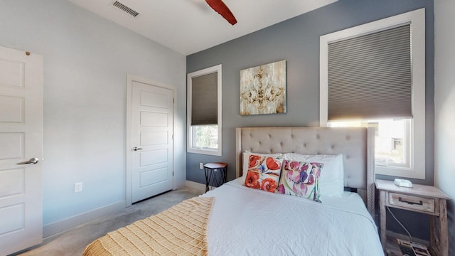 bedroom with ceiling fan and light colored carpet