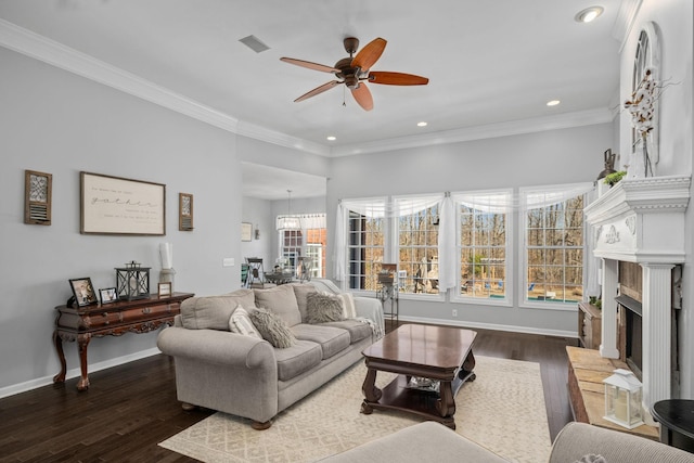 living room with ceiling fan, dark wood-type flooring, and ornamental molding