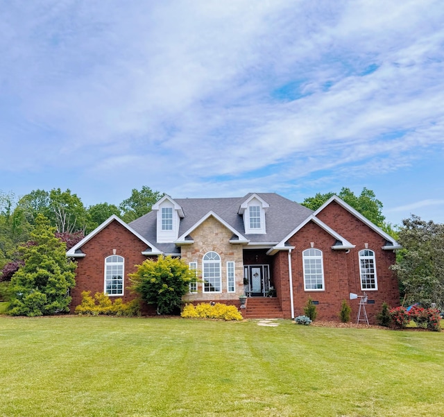 4947 Albert Fentress Rd, Greenbrier, TN 37073 - traditional-style house featuring a front yard, brick siding, and a shingled roof