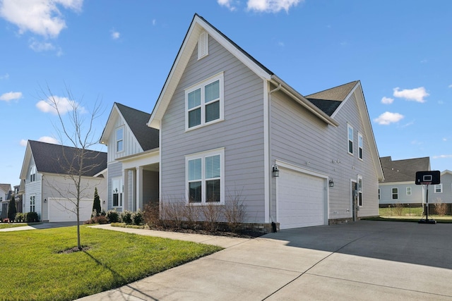 view of side of home featuring a lawn and a garage