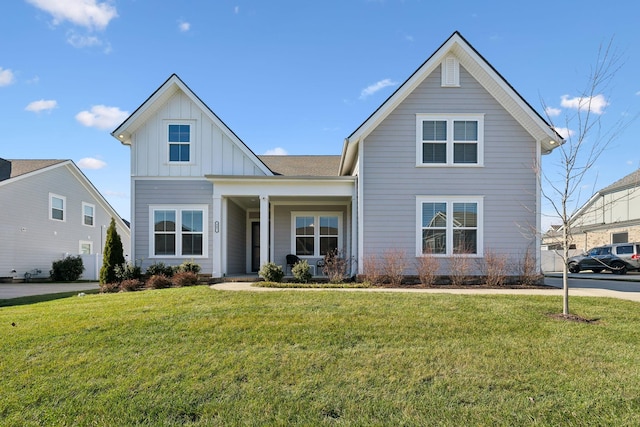 view of front property featuring covered porch and a front yard