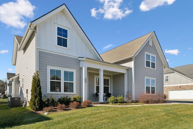 view of front of property with central AC unit, covered porch, and a front lawn