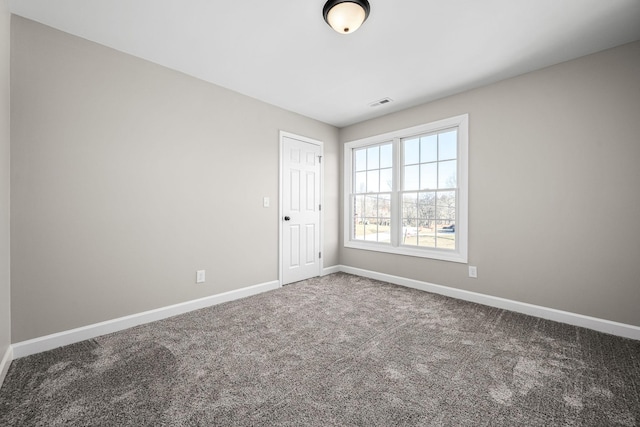 spare room with carpet floors