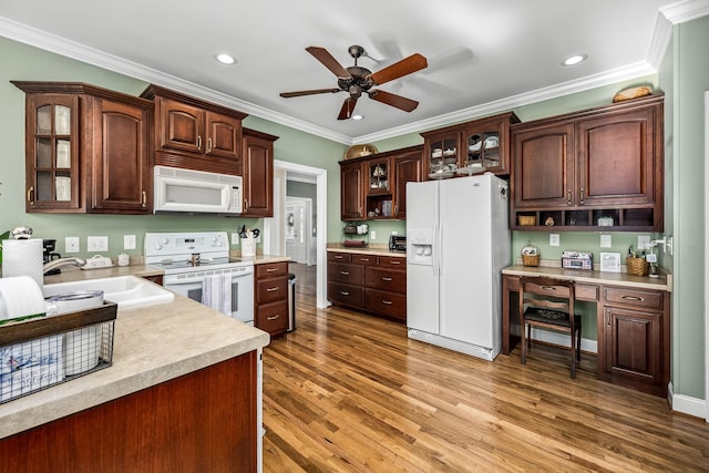 kitchen with dark hardwood / wood-style floors, sink, ornamental molding, ceiling fan, and white appliances