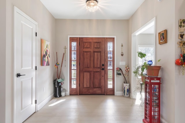 foyer entrance featuring light wood-type flooring