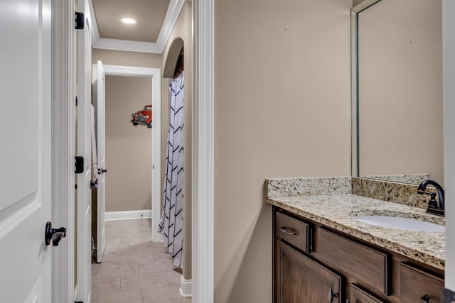 bathroom featuring tile patterned floors, vanity, and ornamental molding