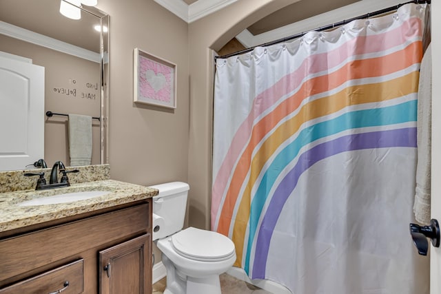 bathroom featuring vanity, toilet, and ornamental molding