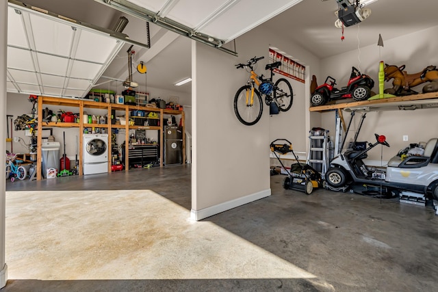 garage with washer / clothes dryer and a garage door opener