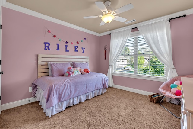 carpeted bedroom with ceiling fan and ornamental molding