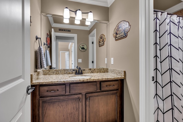 bathroom featuring a shower with curtain, vanity, and crown molding