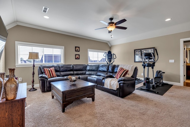 carpeted living room with ceiling fan, lofted ceiling, and ornamental molding