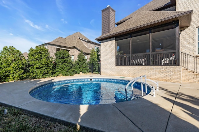 view of swimming pool with a patio area