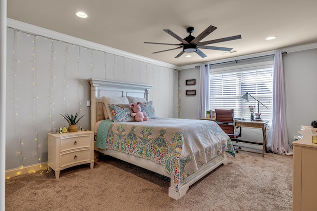 carpeted bedroom with ceiling fan and crown molding