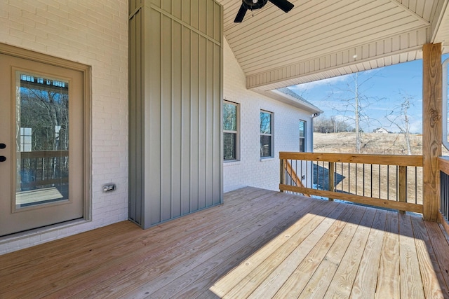 wooden terrace featuring ceiling fan