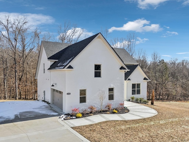 view of side of home with a garage