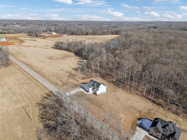 birds eye view of property with a rural view