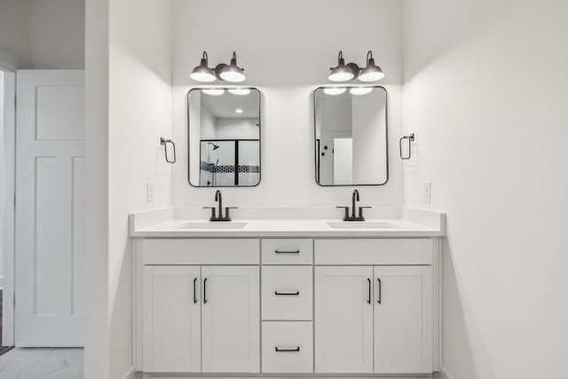 bathroom featuring vanity and an enclosed shower