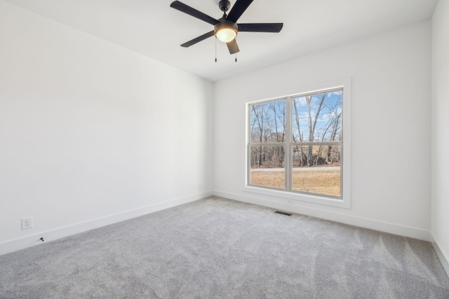 carpeted empty room with ceiling fan