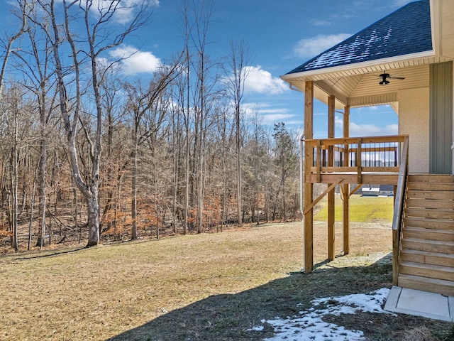 view of yard with ceiling fan