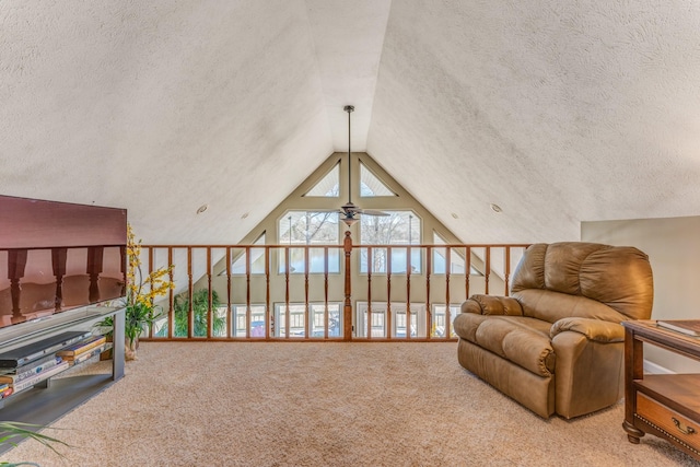 sitting room featuring carpet flooring, ceiling fan, a textured ceiling, and vaulted ceiling