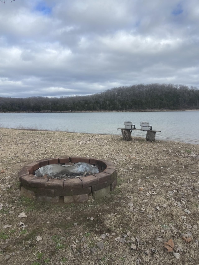 view of water feature featuring an outdoor fire pit