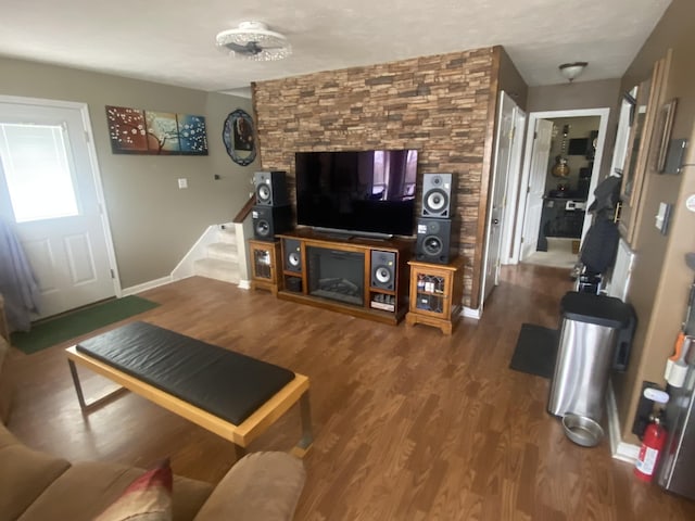 living room with hardwood / wood-style floors and a textured ceiling