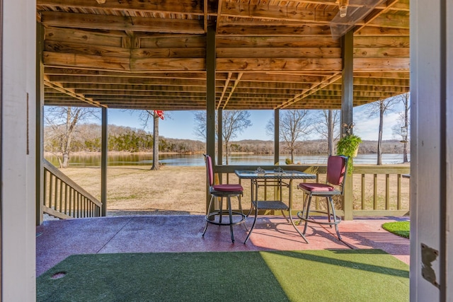 view of patio featuring a water view