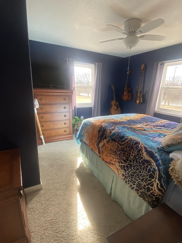 bedroom featuring ceiling fan and carpet floors