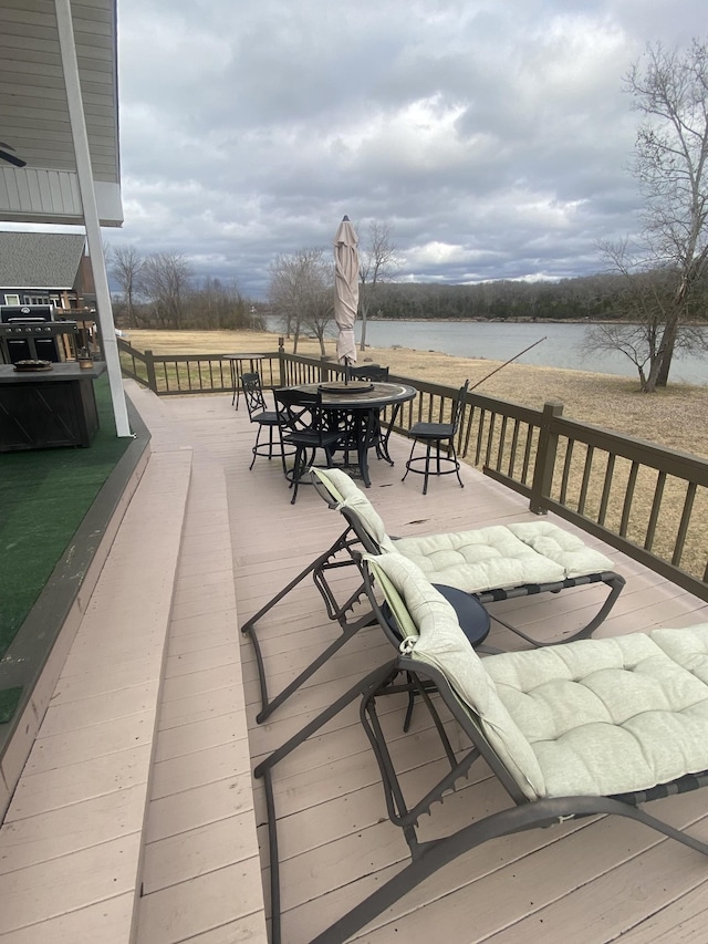 wooden terrace with a water view