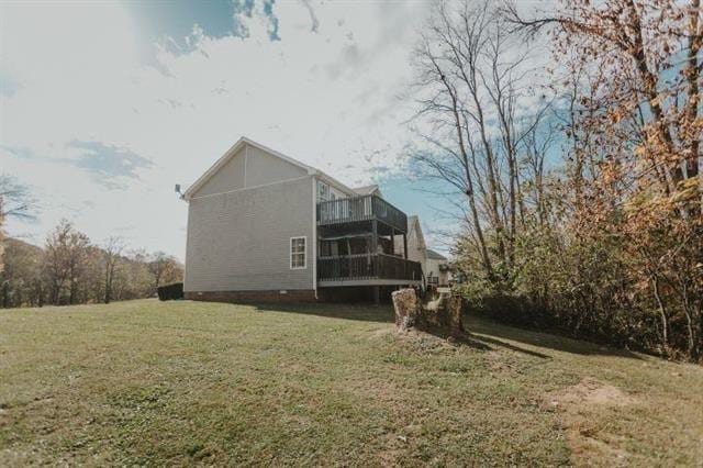 view of side of property with a yard