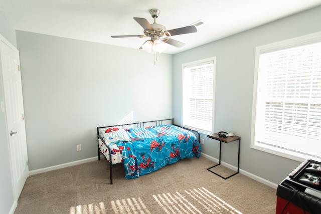 carpeted bedroom featuring ceiling fan