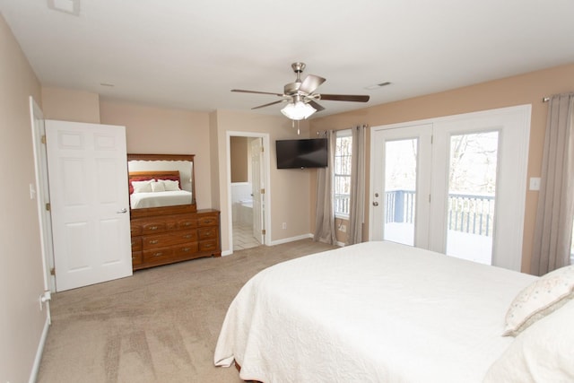 bedroom with access to outside, ensuite bath, ceiling fan, and light carpet