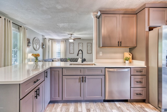 270 River Chase Rd, Allensville, KY 42204 - kitchen featuring appliances with stainless steel finishes, a sink, gray cabinetry, light countertops, and a textured ceiling