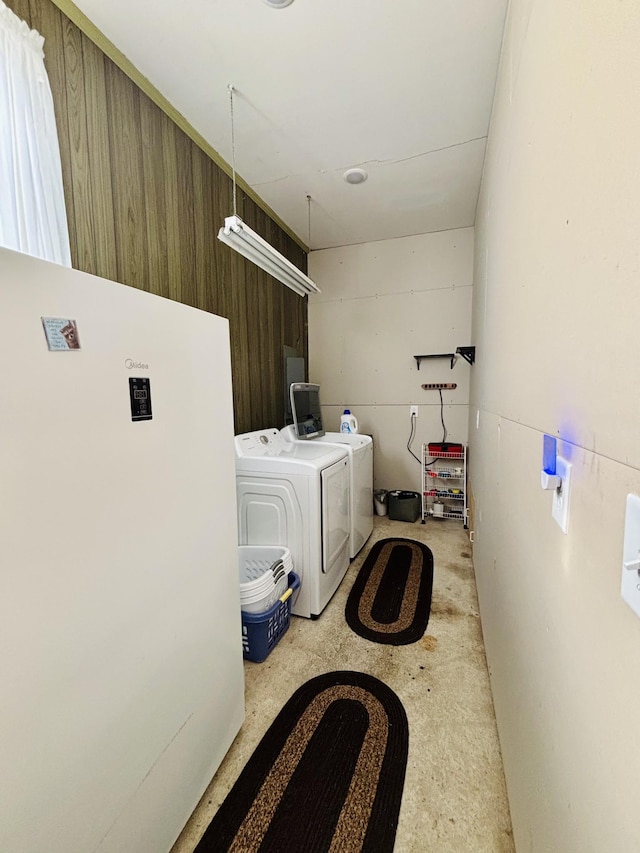 washroom with washer and dryer