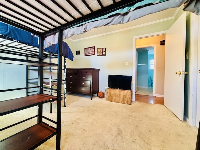 bedroom featuring light carpet and ornamental molding