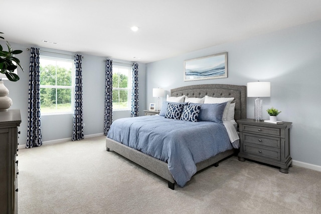 bedroom with light colored carpet