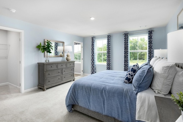 bedroom featuring light carpet