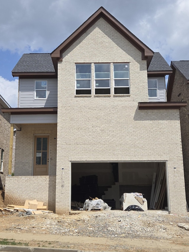 2310 18th Ave N, Nashville, TN 37208 - rear view of house featuring brick siding and an attached garage