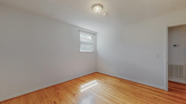 unfurnished room featuring light hardwood / wood-style floors