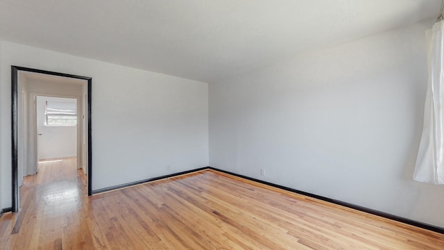 unfurnished room featuring light hardwood / wood-style flooring