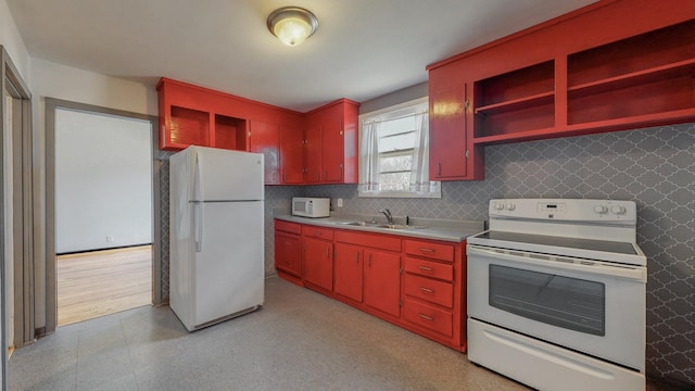 kitchen featuring sink and white appliances