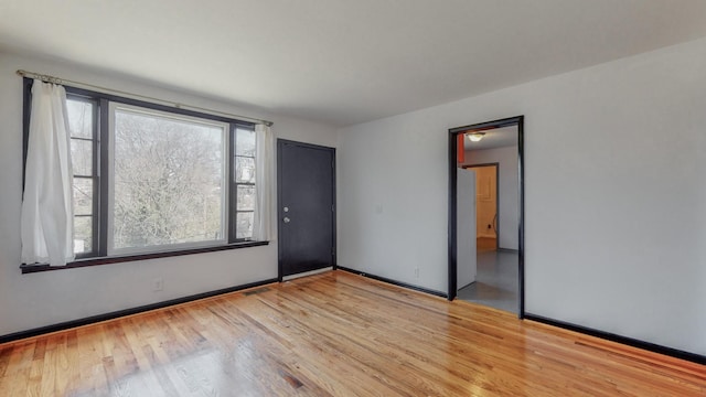 unfurnished room featuring light wood-type flooring