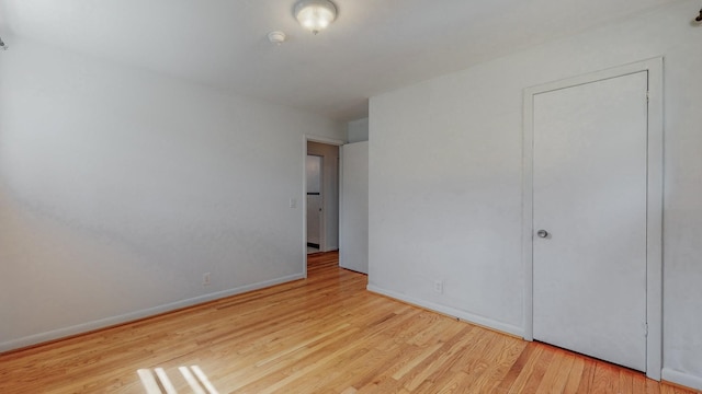 unfurnished bedroom with light wood-type flooring