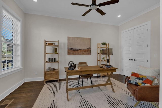 home office with ceiling fan, dark wood-type flooring, and ornamental molding