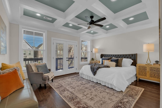 bedroom featuring french doors, dark hardwood / wood-style flooring, coffered ceiling, and multiple windows