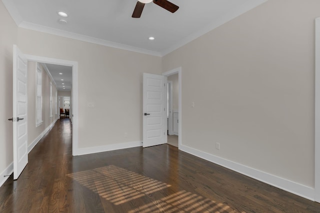 empty room featuring ceiling fan, dark hardwood / wood-style floors, and ornamental molding