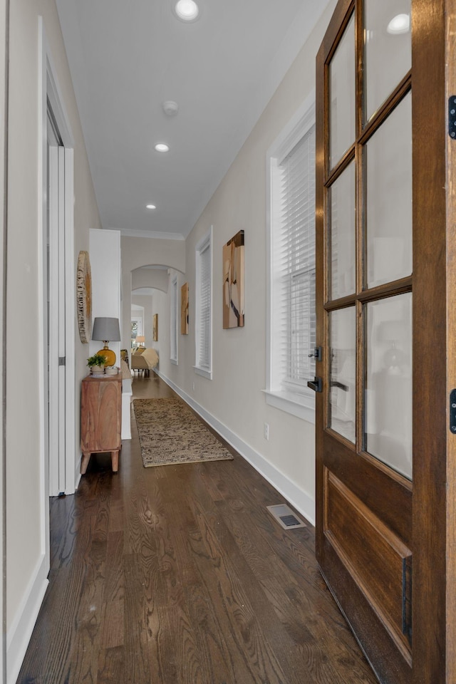 hallway with dark hardwood / wood-style floors