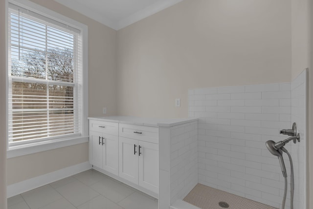 bathroom with ornamental molding, tile patterned floors, plenty of natural light, and vanity