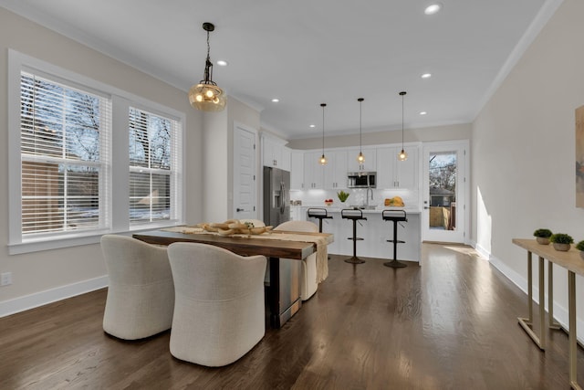 dining space featuring dark hardwood / wood-style floors and crown molding